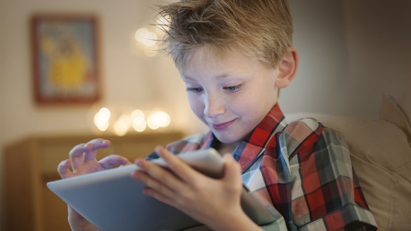 Picture of a boy using a tablet